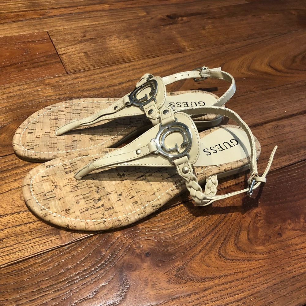Guess flat T-strap sandals defined by metal logo shiny cream colour sz 6.